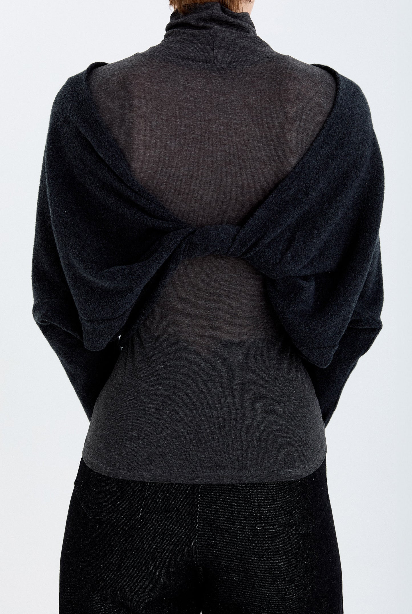 Close-up back detail of the YIBRI Fleece Reversible Twisted Top, showing the twisted construction and soft fleece texture when worn reversed.