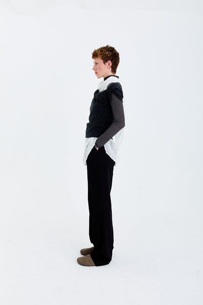Angled model view in the YIBRI Fleece Asymmetrical Shoulder Twisted Top, showing the asymmetric sleeve line and soft fleece drape.