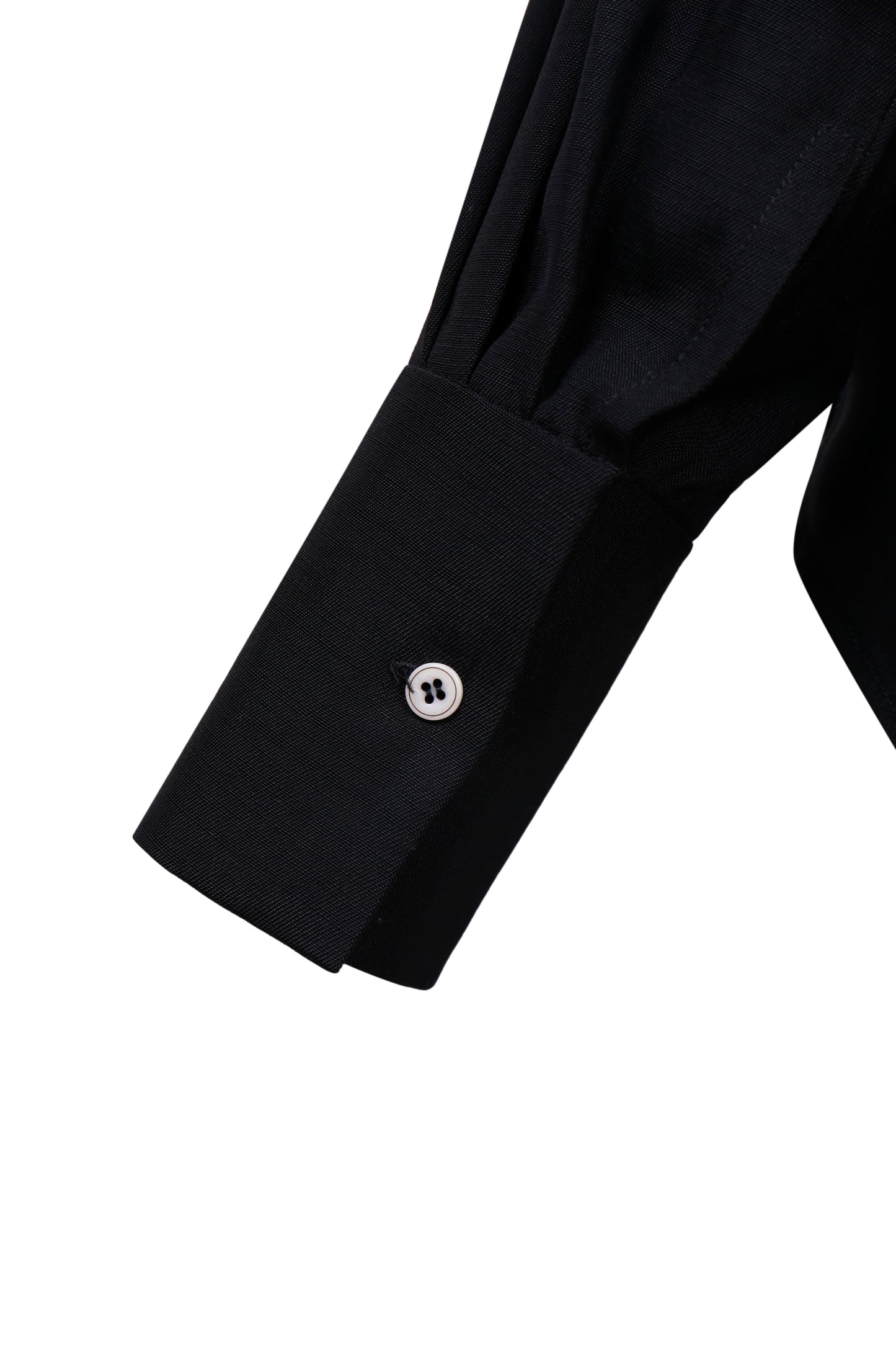 Cuff detail of the YIBRI Black Japanese Viscose Button-Up Shirt with structured sleeve and contrast button.