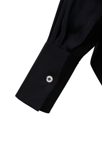Cuff detail of the YIBRI Black Japanese Viscose Button-Up Shirt with structured sleeve and contrast button.