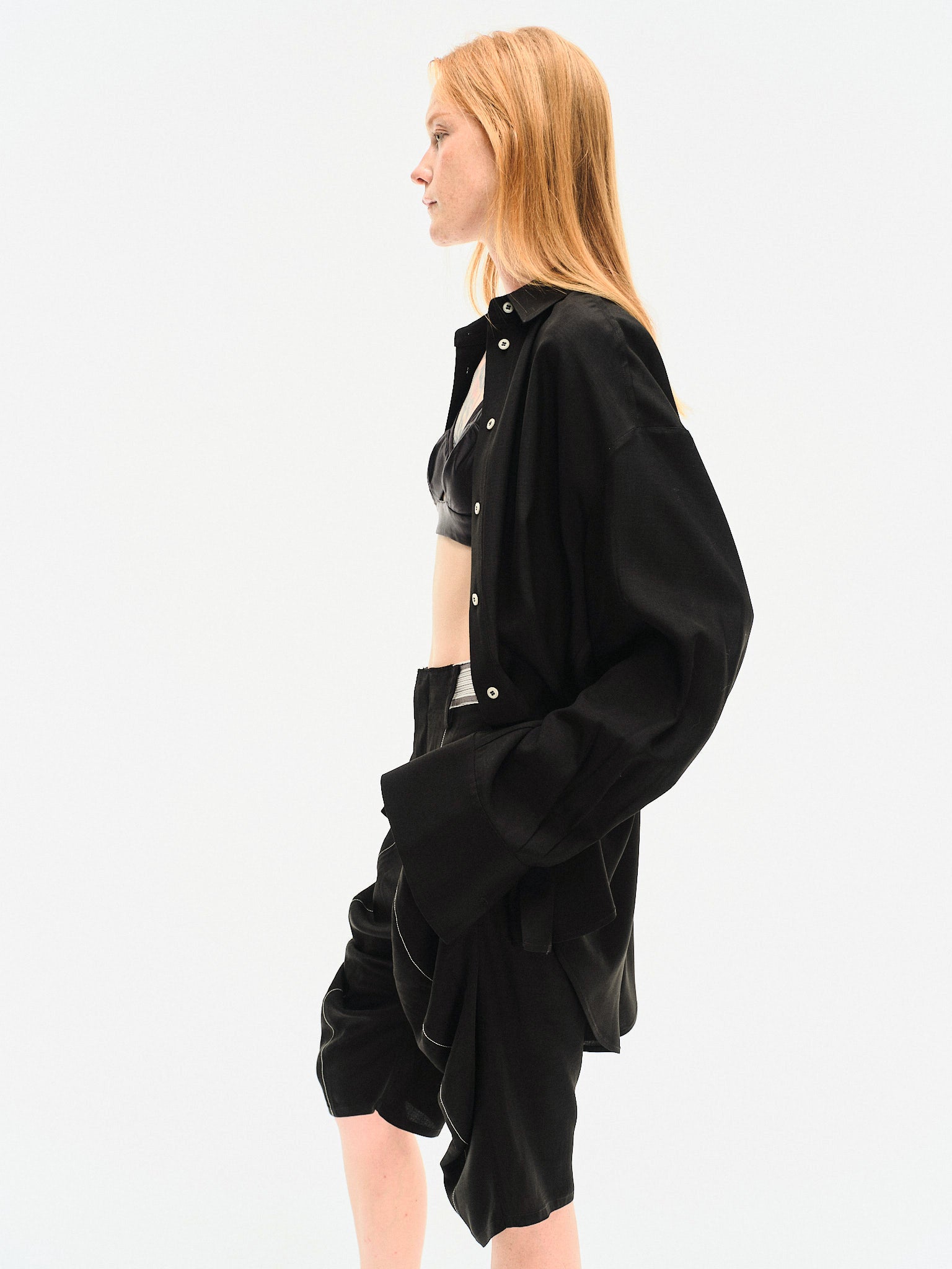 Side profile close-up of YIBRI Black Japanese Viscose Shirt capturing fluid fabric and elegant fall.