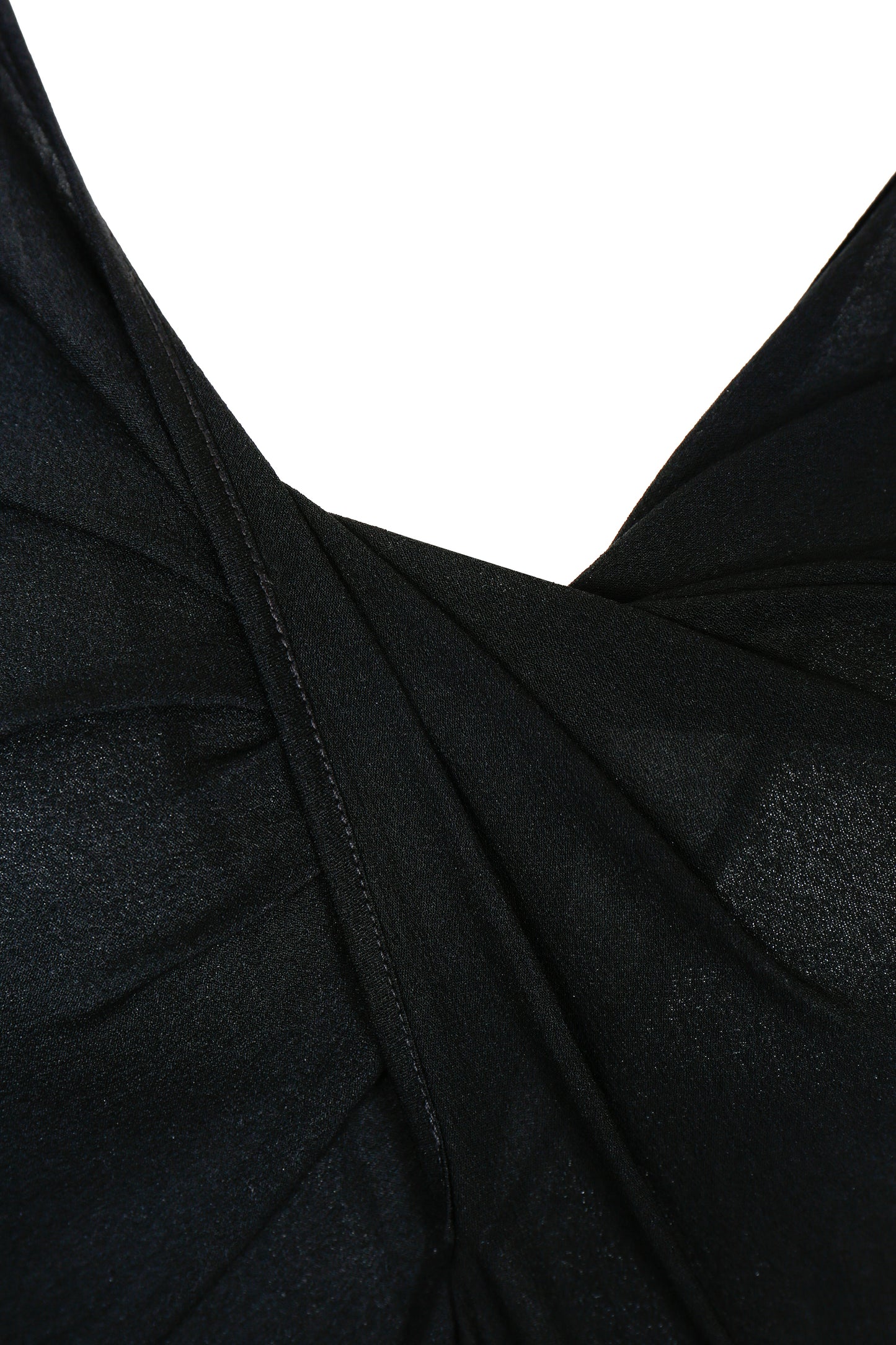 Close-up of twisted drape detail on YIBRI black long sleeve fitted knit dress highlighting refined construction and quiet luxury craftsmanship