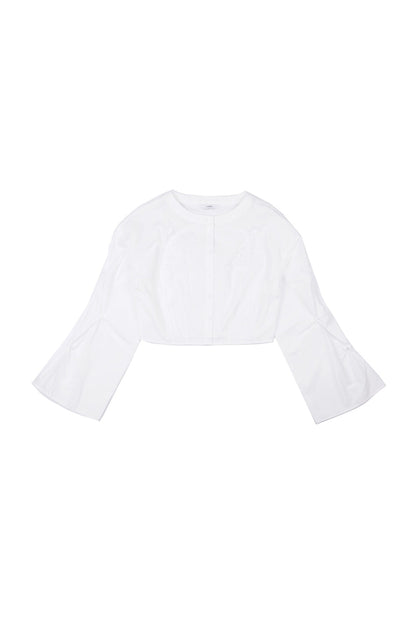 Front view of YIBRI cropped white blouse featuring hand-crocheted floral appliqué, smocked bell sleeves and a clean round neckline — crafted in lightweight cotton poplin.