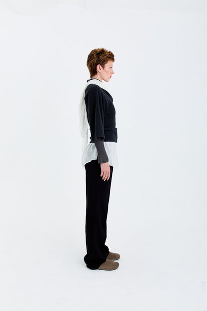 Side view of the YIBRI Fleece Asymmetrical Shoulder Twisted Top, highlighting the sculpted wrap detail and one-shoulder draped shape.