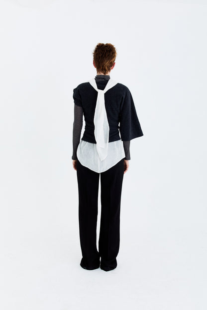 Back model view of the YIBRI Fleece Asymmetrical Shoulder Twisted Top, featuring the twisted wrap construction and clean sculptural fit.