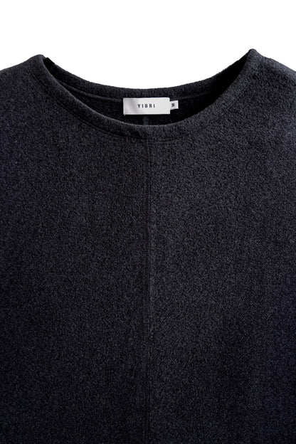 Close-up of the neckline on the YIBRI Fleece Oversized Roll-Sleeve Top, highlighting the soft fleece surface and minimalist finishing.