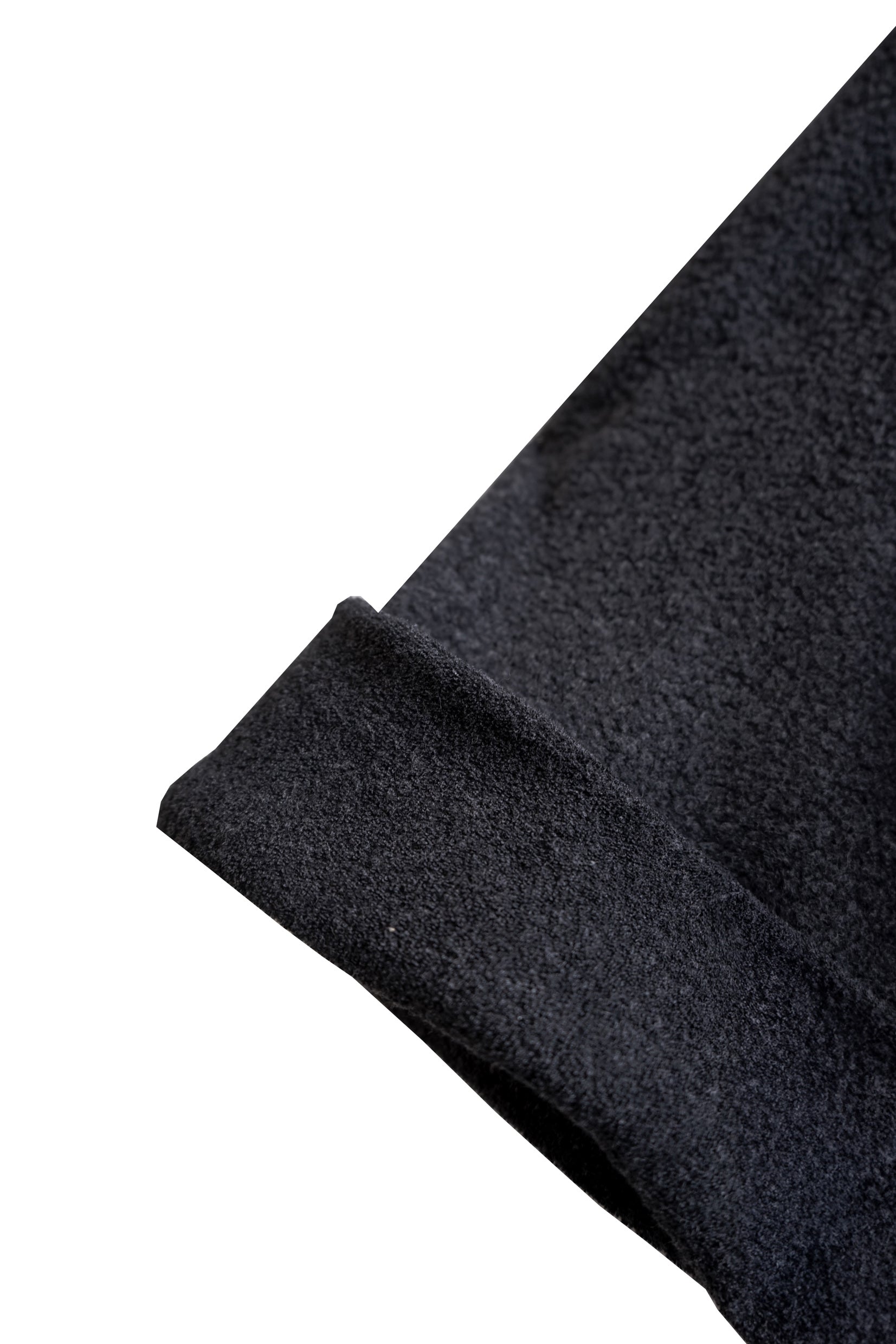 Detail view of the rolled sleeve on the YIBRI Fleece Oversized Roll-Sleeve Top, showing the structured cuff and plush fleece texture.