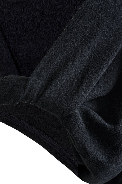 Close-up of the twist detail on the YIBRI Fleece Reversible Twisted Top, highlighting the soft fleece texture and gathered construction.