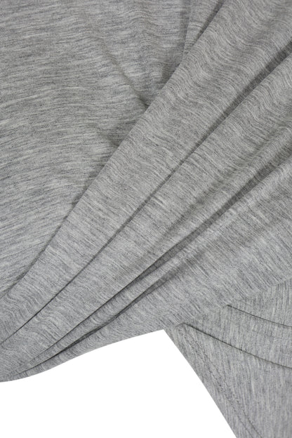 Close-up of YIBRI Grey Draped Jersey Crop Top’s front draped panels, highlighting the soft heather jersey texture and sculptural folds.