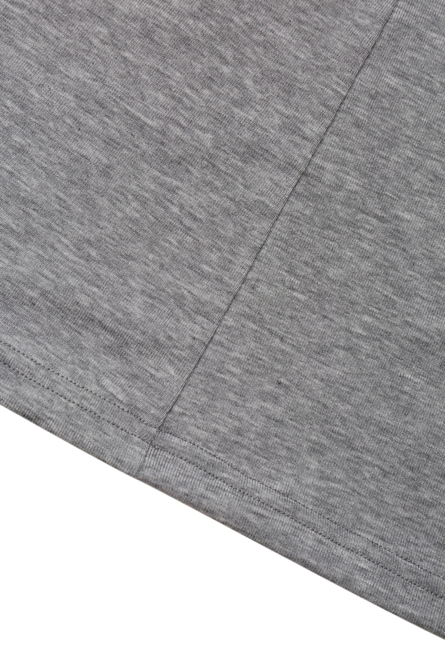 Detail view of the hem and jersey texture on the YIBRI Grey Twisted Long Jersey Sleeve Top, showing the subtle heathered surface.