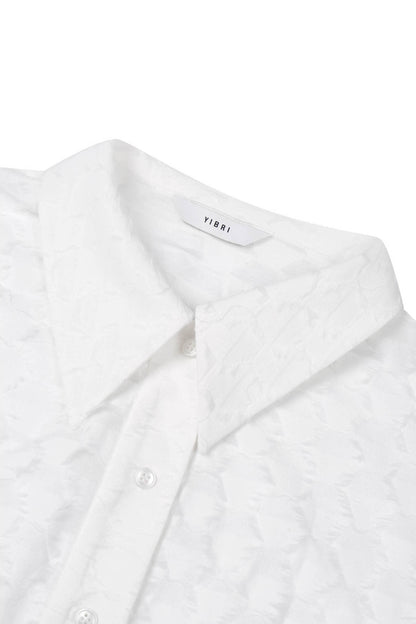 Close-up of the pointed collar on the YIBRI Jacquard Fringe Shirt, showing the soft jacquard surface and delicate fringe pattern.