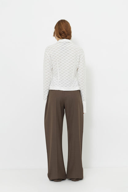 Back view of the YIBRI Jacquard Fringe Shirt on model, showcasing the lightweight semi-sheer jacquard fabric and clean fitted back.