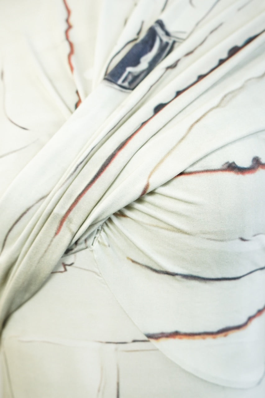 Close-up of the twisted front drape on the YIBRI Printed Stretchy Open-Back Bodysuit, highlighting the marbled print and soft gathered jersey texture.