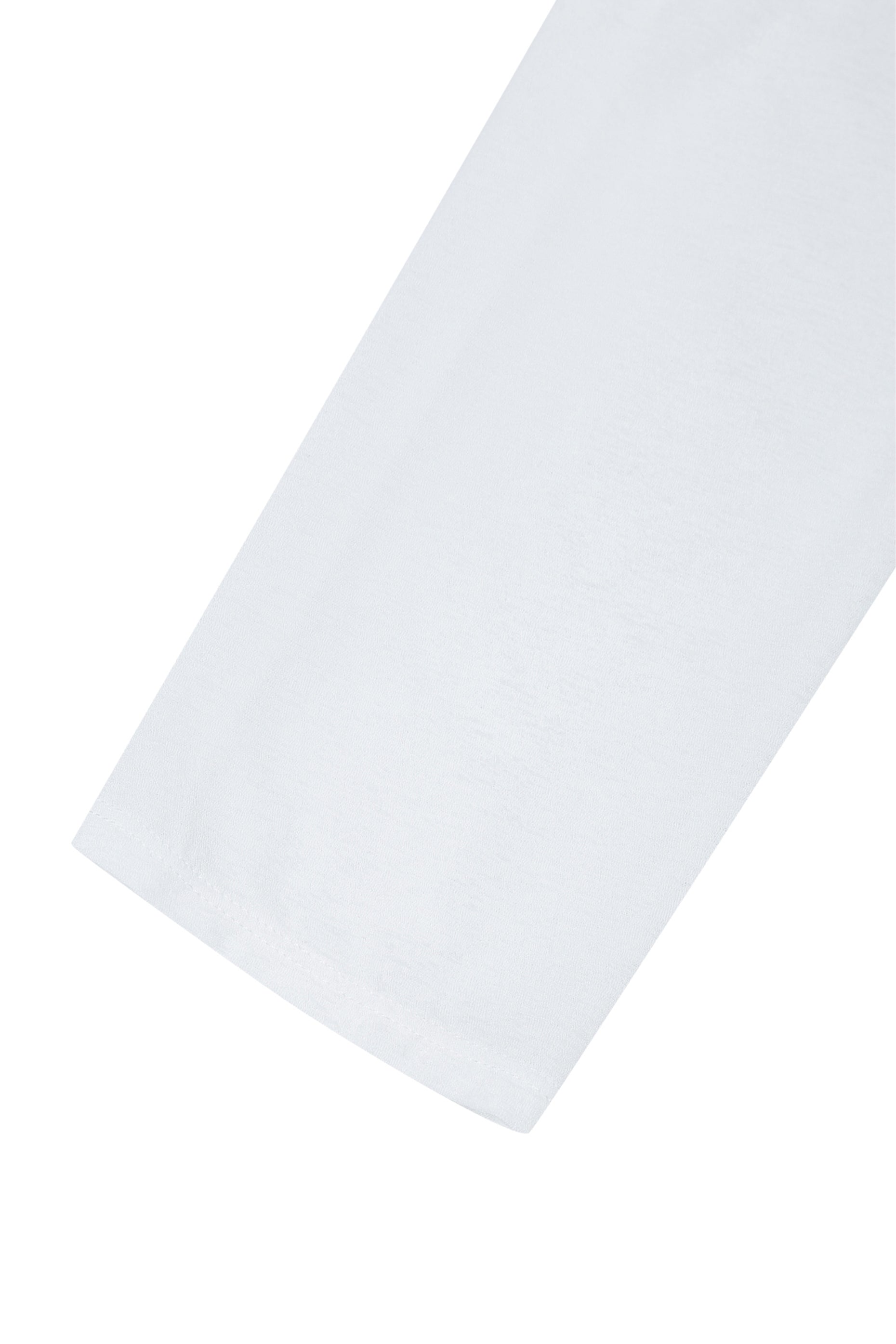 Detail of the sleeve hem on the YIBRI Reversible Cropped Cardigan showing clean finishing and lightweight jersey fabric.