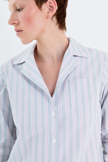 Model close-up of the YIBRI Stonewashed Striped Shirt collar and chest pocket, showing the crisp stripes and stonewashed finish.