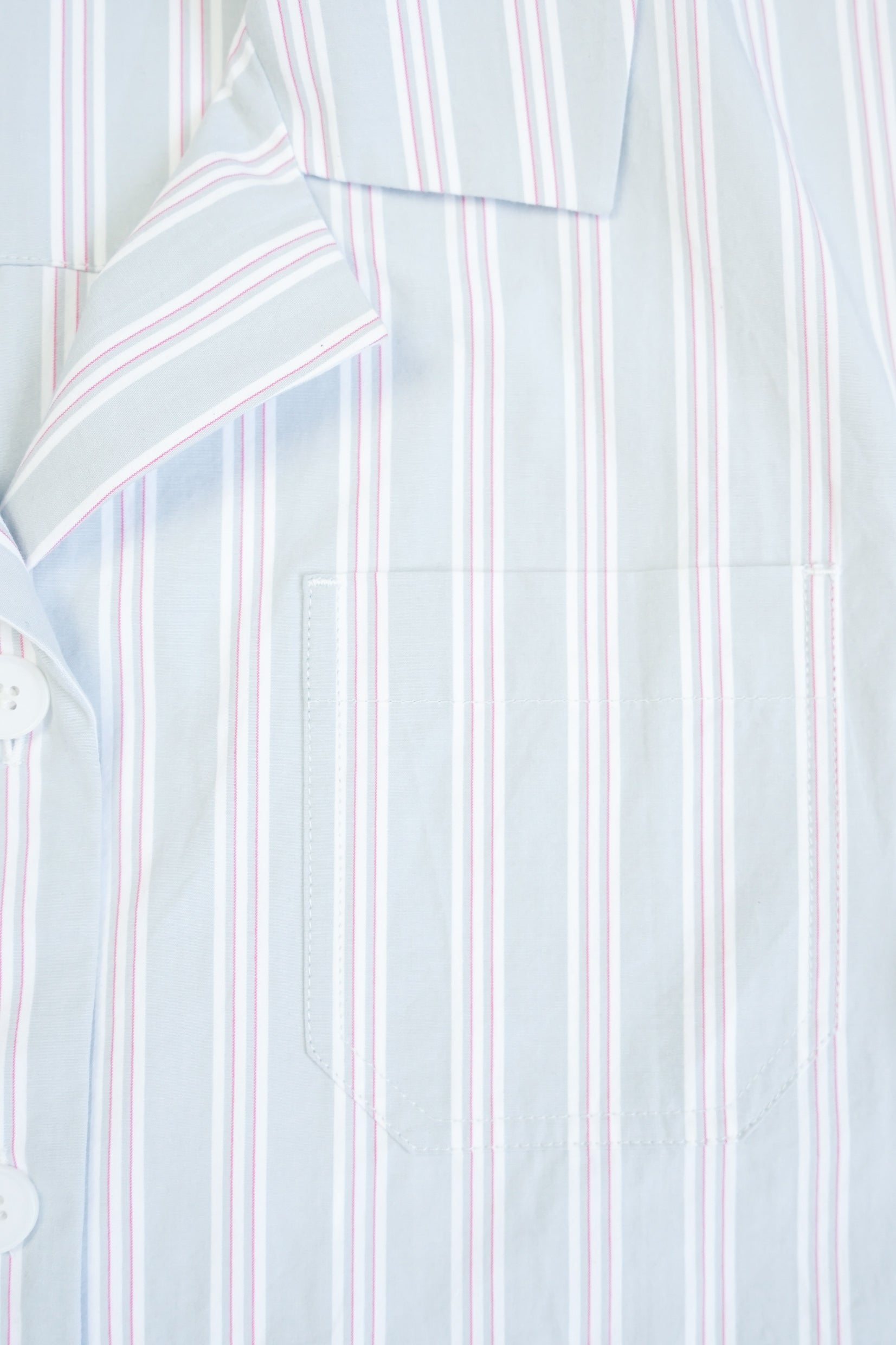 Detail view of the chest pocket and stripes on the YIBRI Stonewashed Striped Shirt, showing the clean stitching.