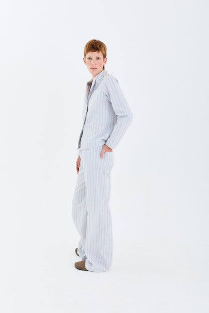 Model side view wearing the YIBRI Stonewashed Striped Shirt, highlighting the relaxed fit and clean vertical stripe lines.