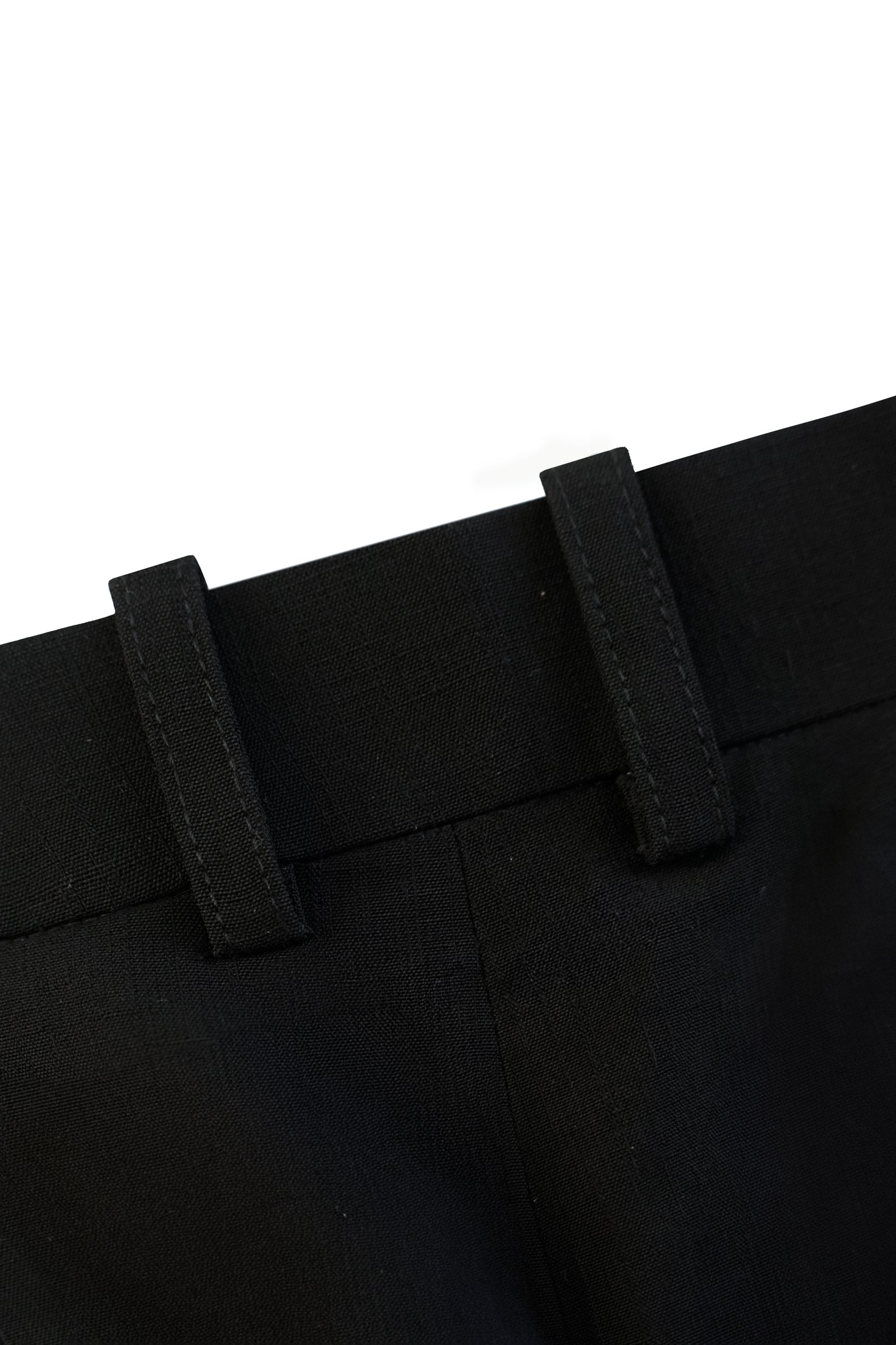 Close-up of the tailored waistband and structured belt loops on the YIBRI Straight-Leg Suit Trousers.