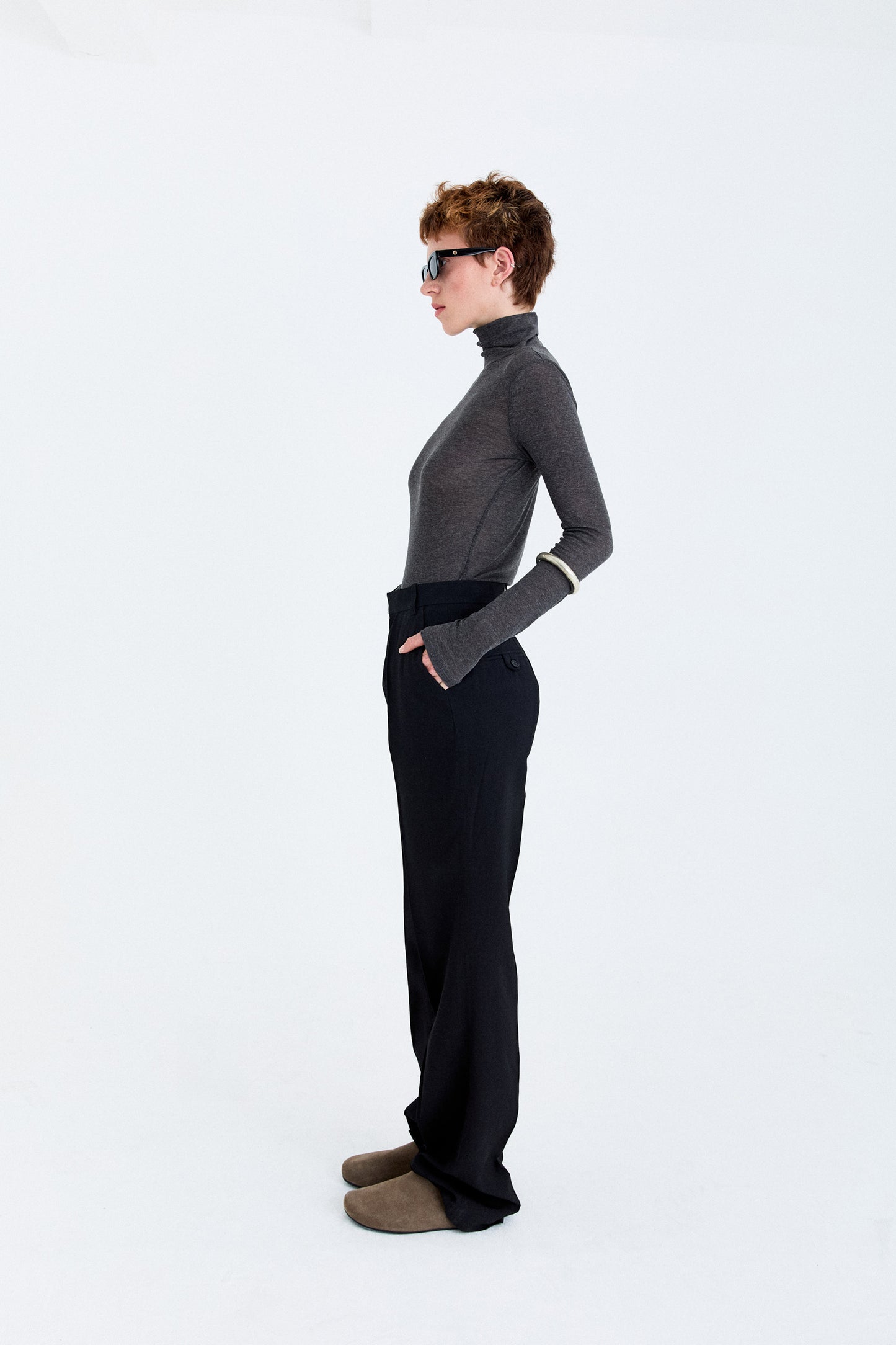 Side view of the YIBRI Straight-Leg Suit Trousers on model, showing the soft straight-leg line and fluid movement.