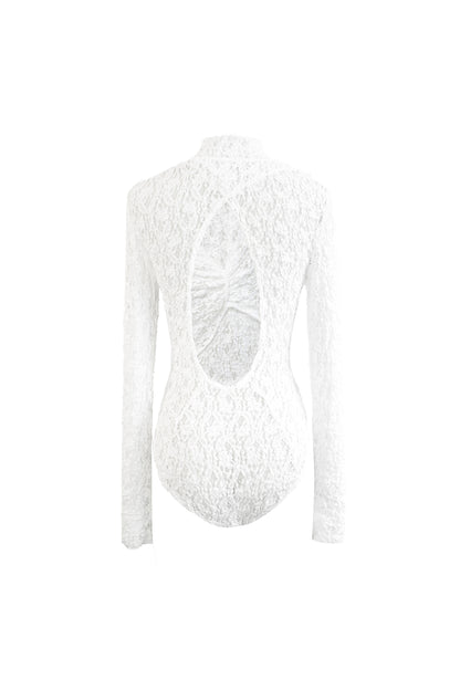 Back view of YIBRI Reversible Twisted-Knot Top in white lace, showcasing the signature open cut-out back and softly gathered twist detail.