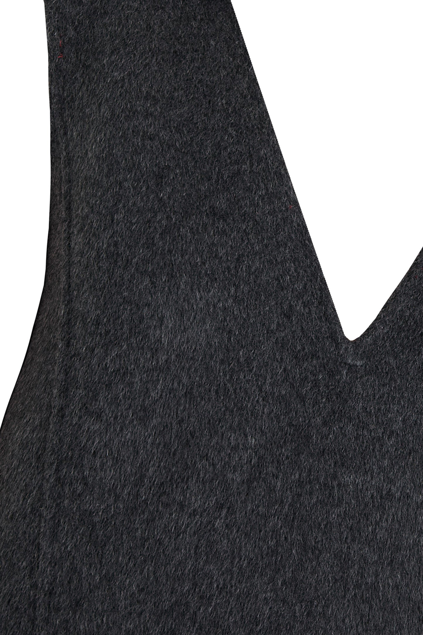 Close-up of a textured long hair double face wool fabric with a V-shaped cutout on a white background