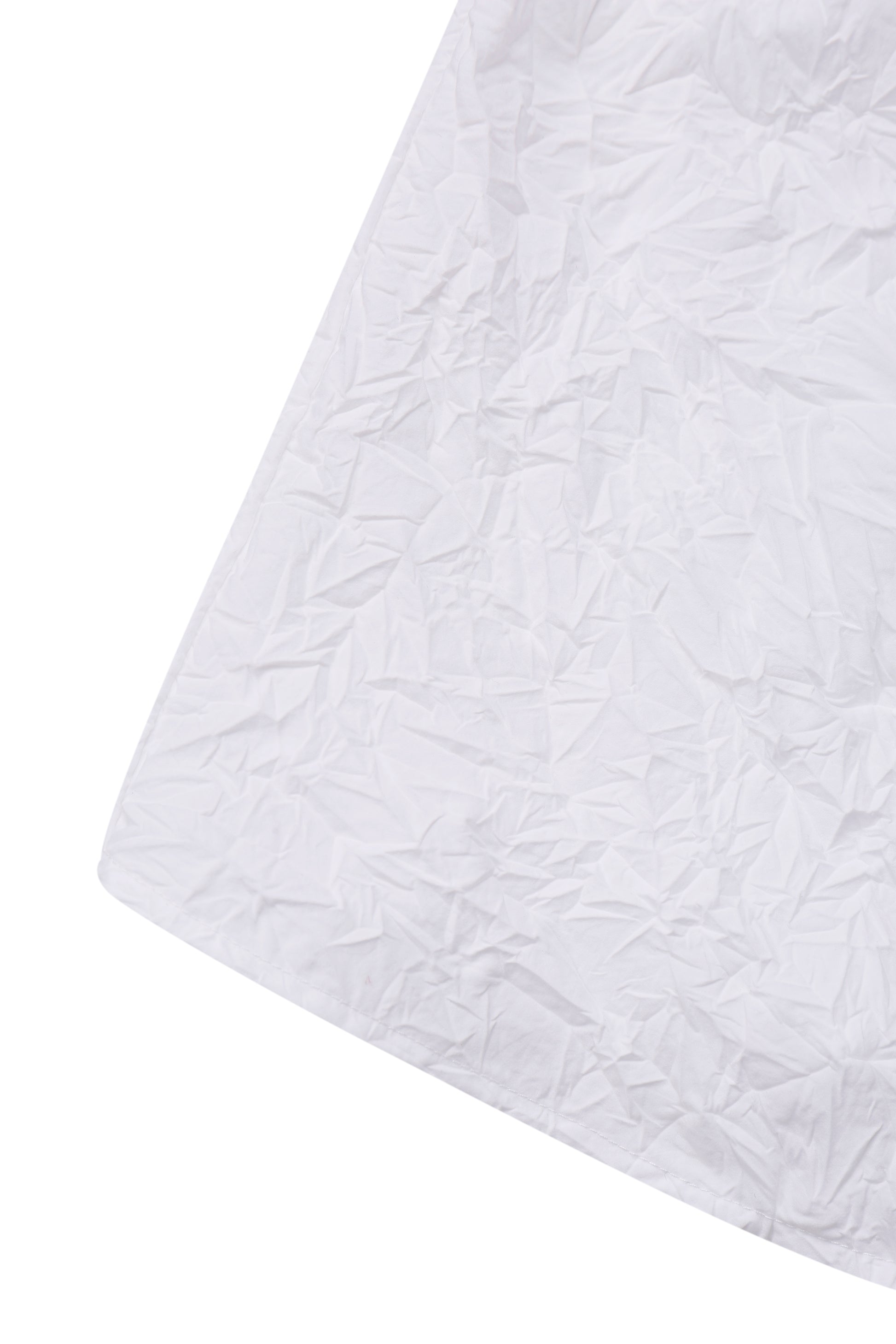 Detail of the hem on the YIBRI White Crinkled Texture Sleeveless Top showing the irregular crinkled structure and soft sculptural folds.
