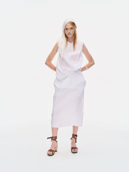 Model wearing the YIBRI White Crinkled Texture Sleeveless Top styled with a matching skirt, emphasising the garment’s fluid drape and sculptural crushed movement.