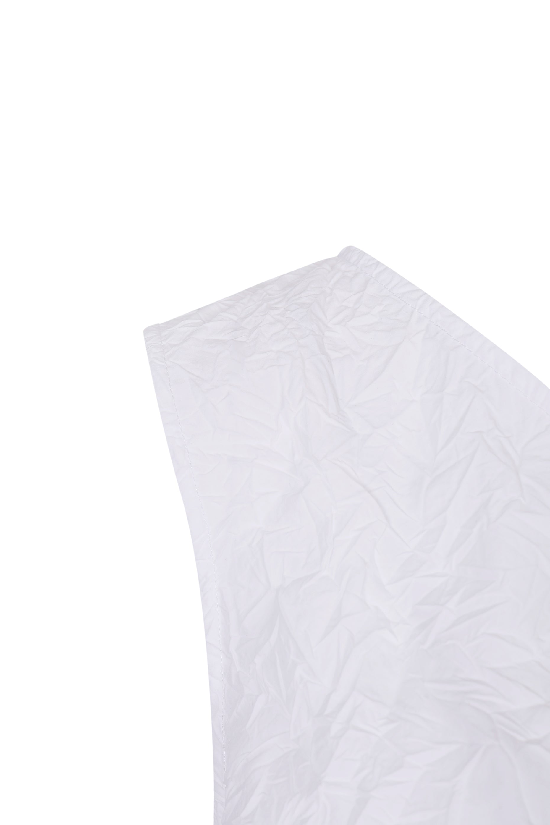 Close-up of crinkle texture on YIBRI White Sculpted Crinkle Mini Dress highlighting sculptural detailing and refined quiet luxury craftsmanship