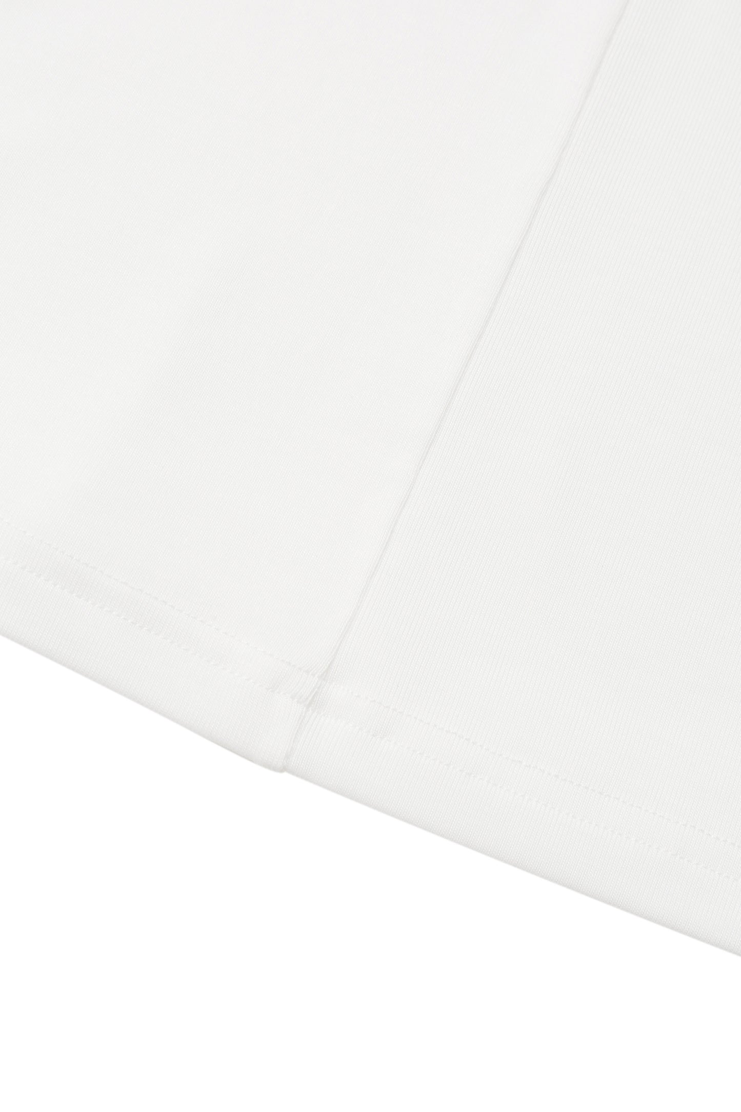 Close-up of the hem on the YIBRI White Twisted Long Jersey Sleeve Top, highlighting the fine jersey stitching and subtle ivory tone.