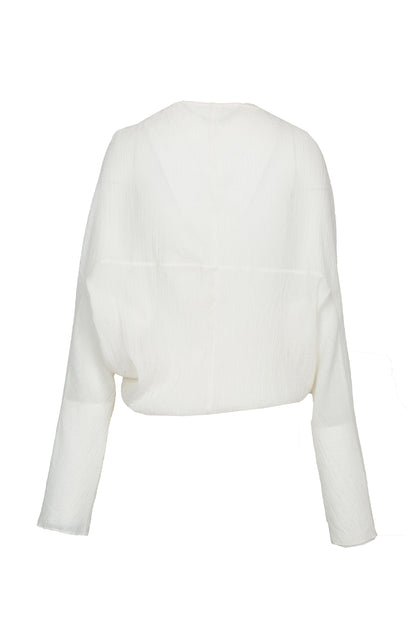 Back view of the YIBRI White Wrinkle-Textured Reversible Top showing the relaxed batwing shape, soft texture and clean back panels.