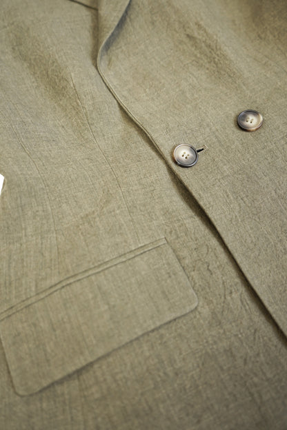 Detail shot of the double-breasted buttons and textured linen fabric on the YIBRI Yarn-Dyed Linen Double-Breasted Blazer.